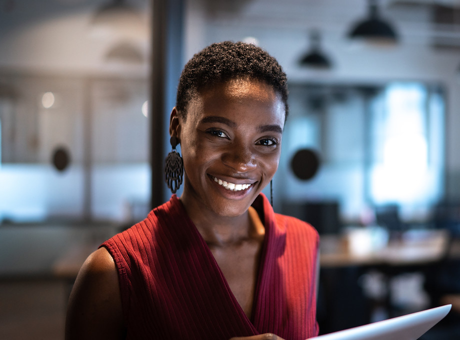 Professional reviewing documents on a tablet